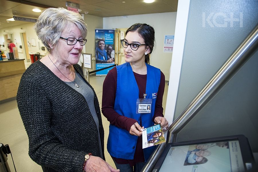 A patient in the Cancer Care centre at KGH learns about the new kiosks.