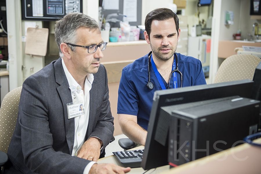 Dr. Damon Dagnone and resident Dr. Aaron Ruberto take a look at the new online system that will be used to provide feedback to residents
