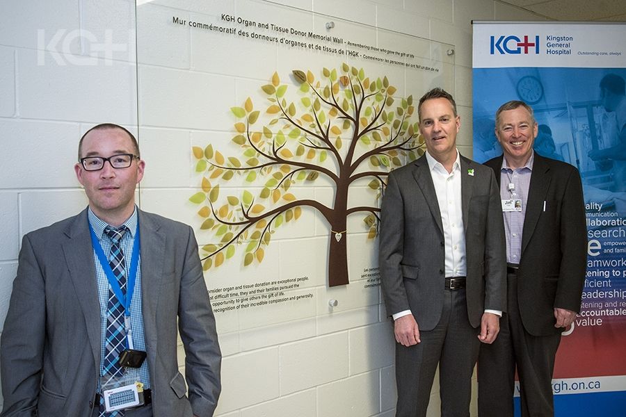 (L to R) Critical Care Physician Dr. Gordon Boyd, Michael Ward from the Trillium Gift of Life Network and KGH Interim CEO Jim Flett stand in front of the new donor wall.
